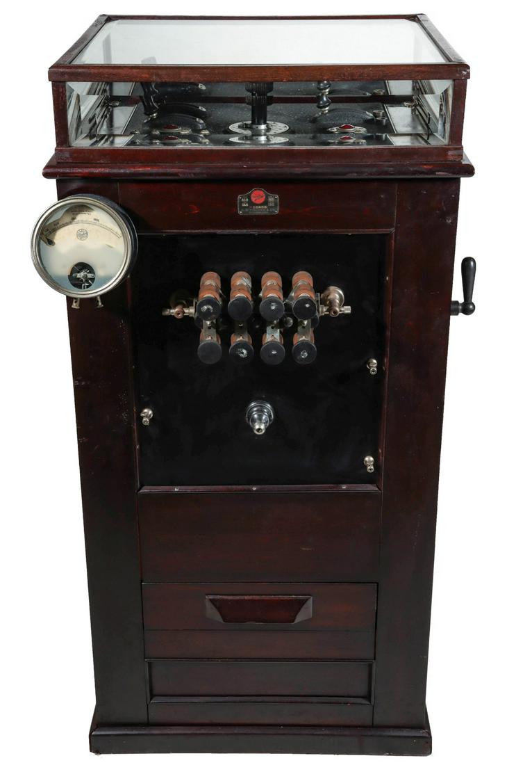 A FISCHER FLOOR MODEL ELECTROTHERAPY DIATHERMY MACHINE: The early 20th century floor model Fischer brand Type SLO diathermy machine with interesting accessories and period manuals, circa 1920. Measures 50 x 25.5 x 23 inches. Please be aware that this lot i