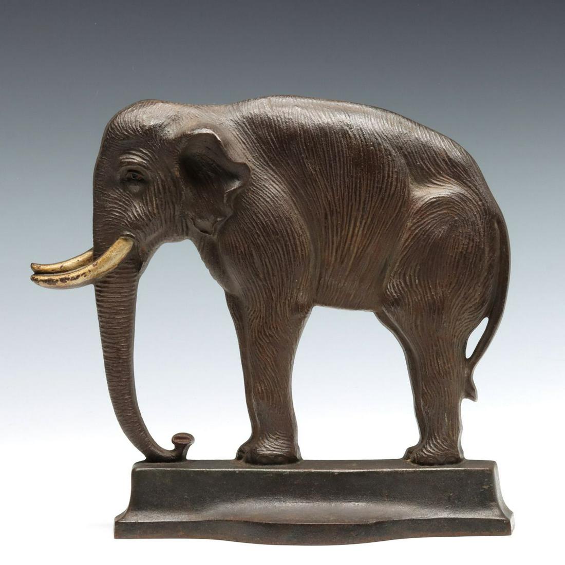 A FINELY DETAILED BRADLEY HUBBARD ELEPHANT DOORSTOP: The nice example of this high quality doorstop B & H number 7766 as signed in the casting, with exceptional detail throughout, good original paint and appealing patina. Measures 10 x 11 x 3 inches