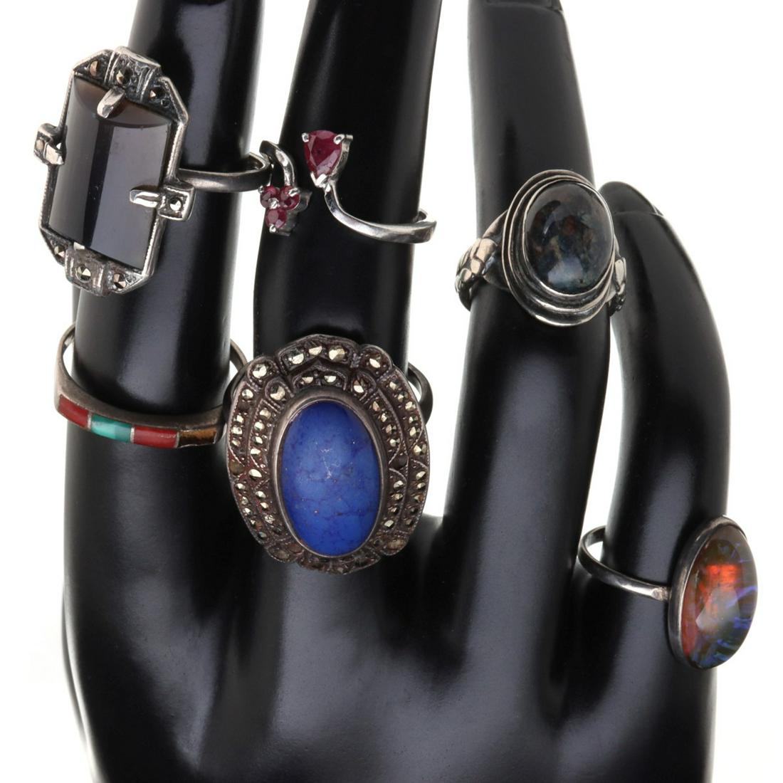 STERLING SILVER RINGS INCLUDING ART DECO WITH MARCASITE: The collection as shown, plus a Victorian pin with garnets. Ring sizes 4, 5 and 8, pin measures 1.5 inches. We happily provide seamless in-house packing and shipping services on nearly everything we s