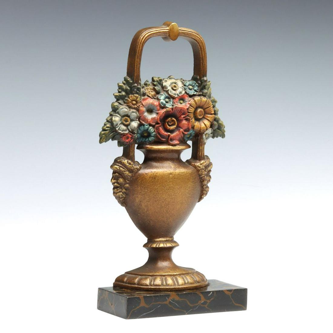 A BRADLEY & HUBBARD URN OF MIXED FLOWERS DOORSTOP: The cast iron doorstop with nice original paint, including the faux marble base, design #369-N, unsigned. Measures 10 x 4.75 x 3 inches. We happily provide seamless in-house packing and shipping servi