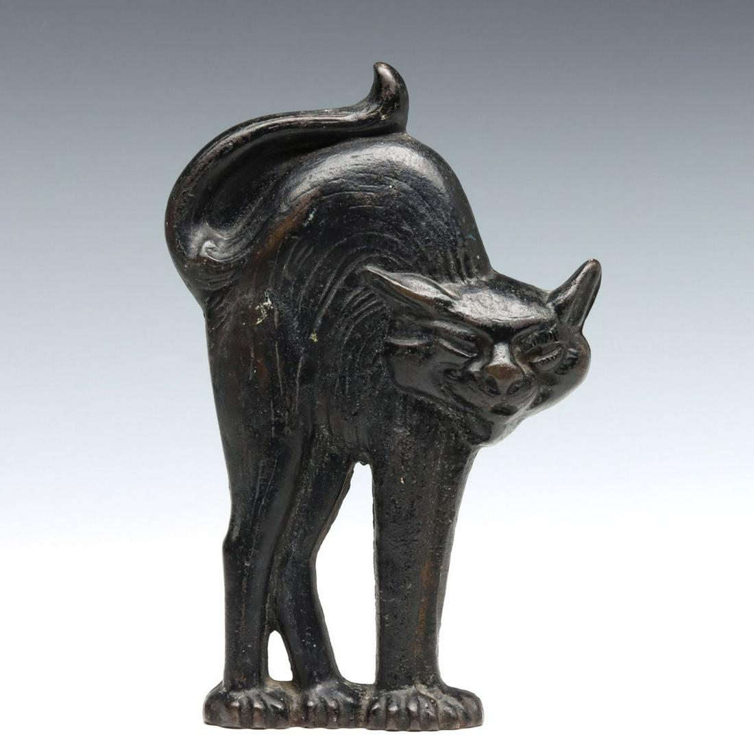 A HALLOWEEN BLACK CAT CAST IRON DOORSTOP: The single-sided black 'Halloween' cat doorstop, numbered 973 in the casting. Measures 10 x 6.5 x 2.5 inches. We happily provide seamless in-house packing and shipping services on nearly everything we