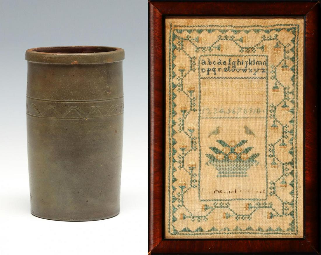 STONEWARE WHIMSEY JAR DATED 1878 AND AMERICAN SAMPLER: The wheel thrown stoneware jar with incised bands and undulating squiqqle bears a scratched dedication 'T.S. borders to Bacco JarMade By W. Boders on June 5th 1878' is paired with a 19th century Ameri