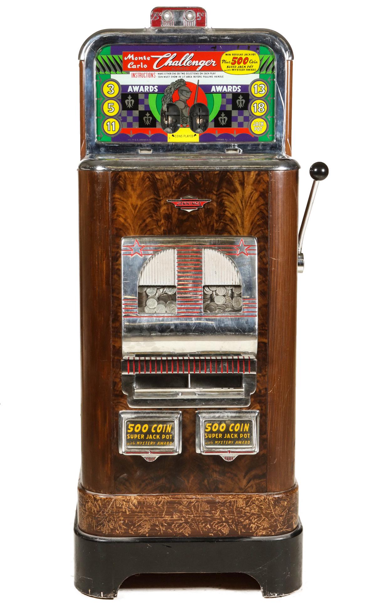 AN UPRIGHT MONTE CARLO CHALLENGER SLOT MACHINE: The 'Super Jackpot' model from 1948 with receiver for 25 cent and 5 cent play above the reverse painted glass marquee and reverse painted glass core card with three reels on grained cabinet with side