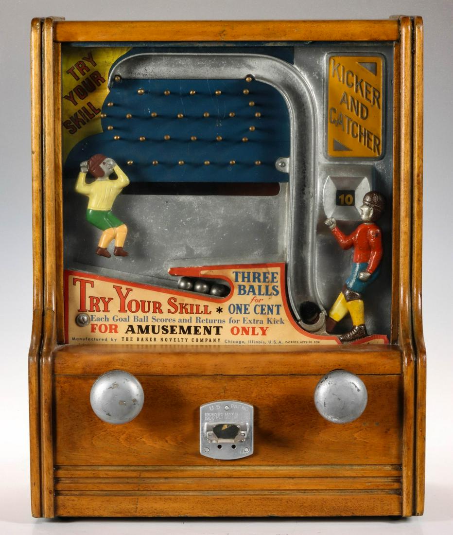 A MECHANICAL ANIMATED KICKER-CATCHER TRADE STIMULATOR: The mechanical 'Kicker and Catcher' penny arcade football theme countertop trade stimulator manufactured by The Baker Novelty Company declares 'Try Your Skill - Each Goal Ball Scores And Returns For E