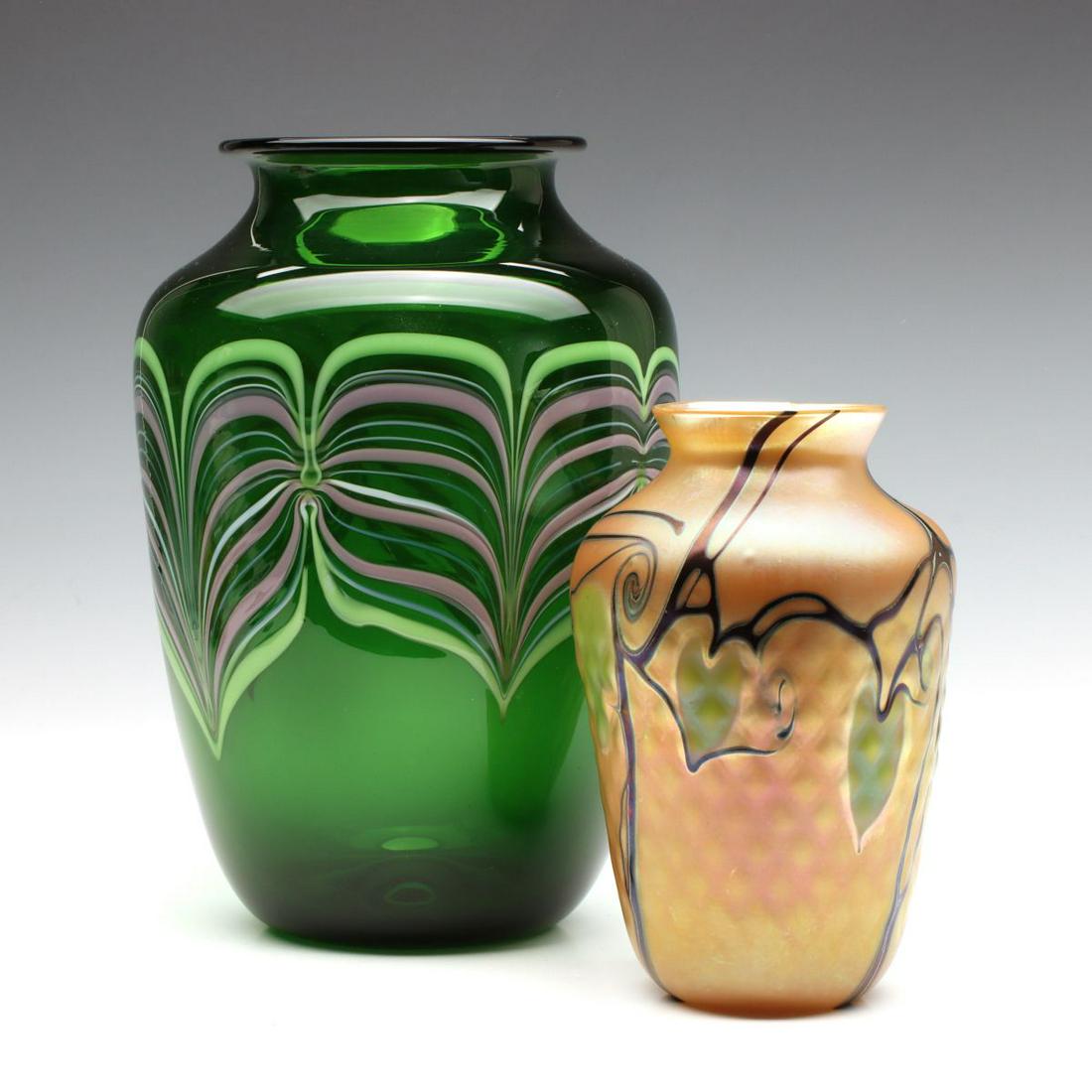 TWO VERY GOOD ORIENT AND FLUME ART GLASS VASES: The larger glossy green vase with feather chain internal decoration is signed and numbered on the base with date of 1984. The smaller opaque example with hanging heart decoration on gold iridescent gr