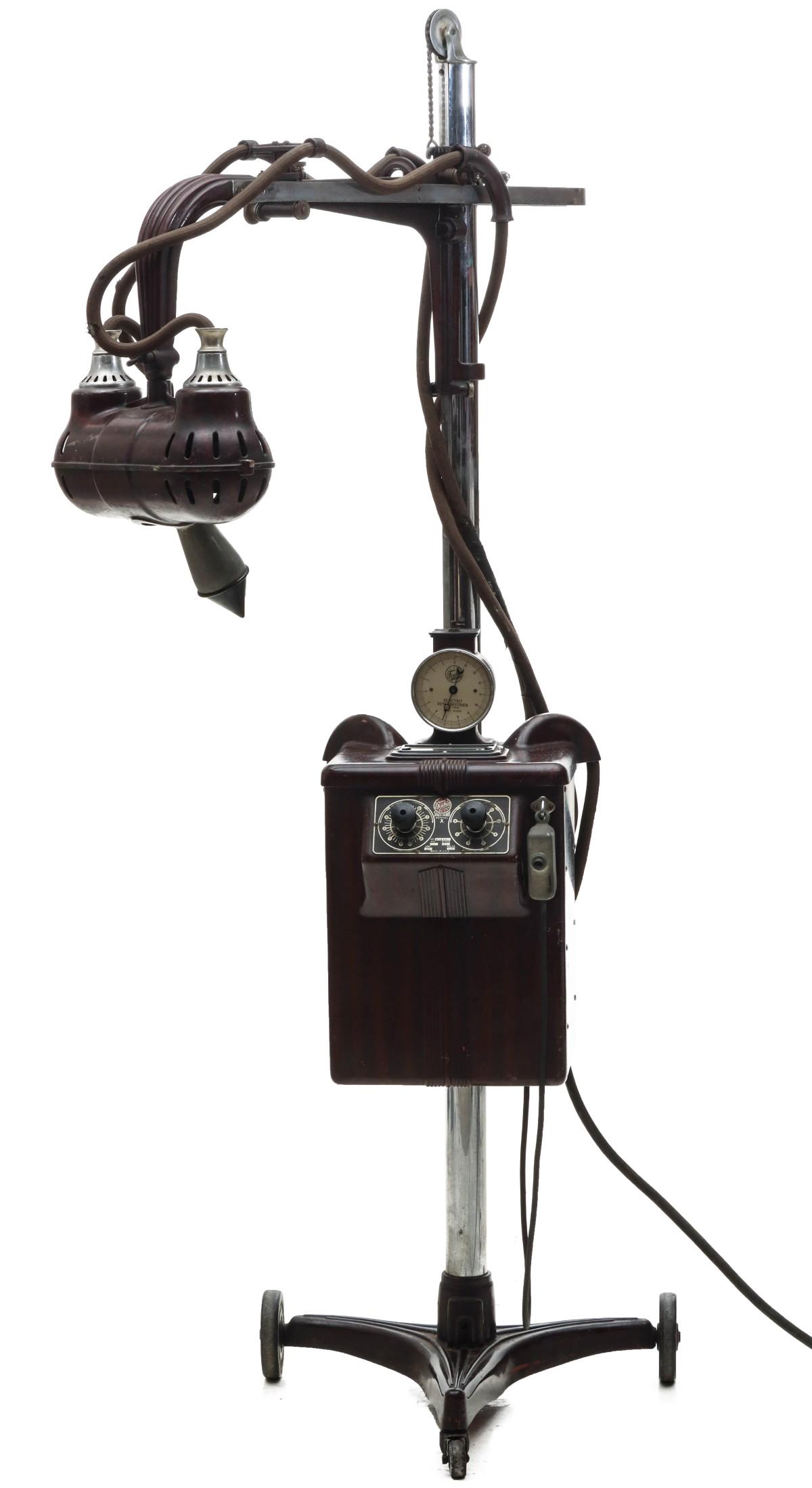 A RARE FISCHER DENTAL X-RAY MACHINE CIRCA 1930: The extendable and multi-directional arm directs the head and the x-ray beam generated by cathode and anode. Measures 75 x 38 x 14 inches. Please be aware that this lot is too large to ship by convent