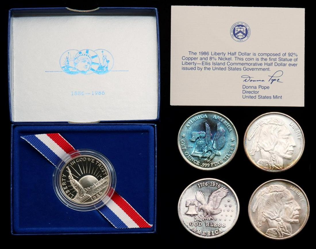 A COLLECTION OF SILVER BULLION COINS, 1986 HALF DOLLAR: A 1-oz. Eagle Bell .999 fine silver coin; Two 1-ozt. Buffalo Round .999 silver coins; A 1-ozt. Tri-State Refining .999 silver coin; and A 1986-S Statue of Liberty Ellis Island Commemorative Half Dolla
