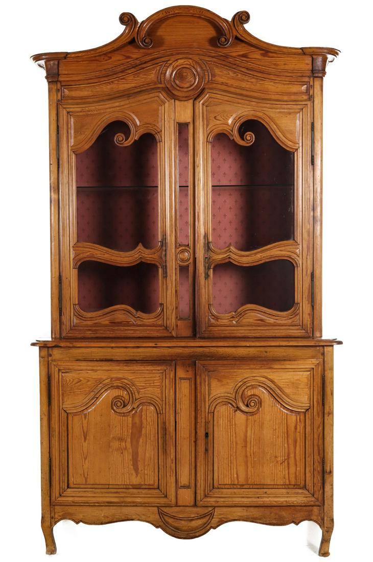 A PINE 19TH C. COUNTRY FRENCH BUFFET DEUX CORPS: The late 18th century to early 19th century two-piece breakfront or buffet of Louis XV influence with scrolling crown over two doors with scrolled openings above the outset base with matching lower do