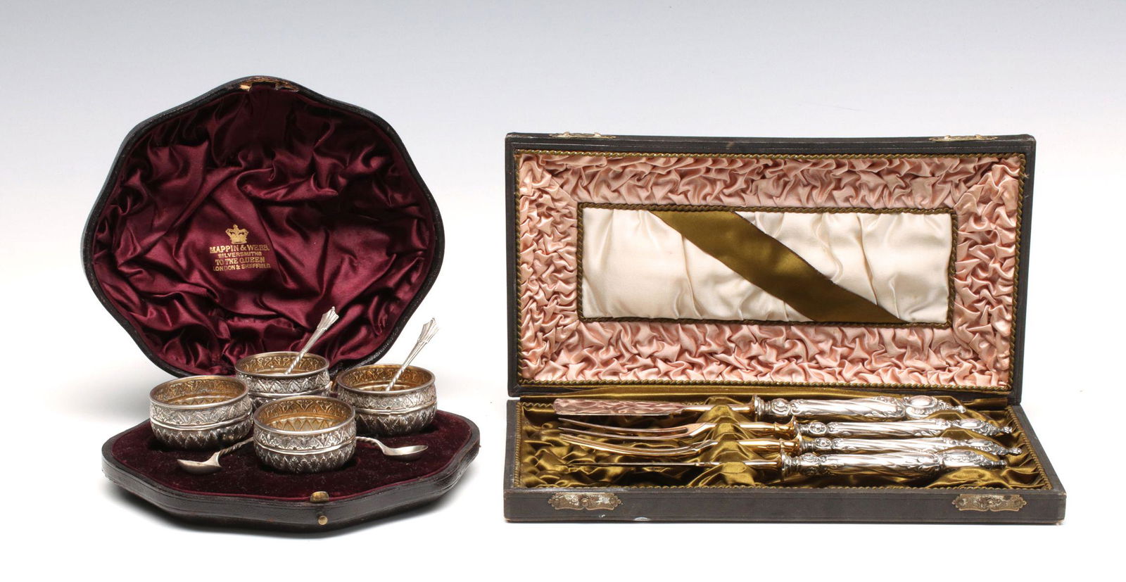 ENGLISH STERLING SILVER SALT CELLARS AND CARVING SET: Four salt cellars with spoons and the original fitted presentation case, cellars signed Mappin & Webb Silversmiths, date mark 1889. Plus a four piece cheese carving set with unusual piece types. hollo