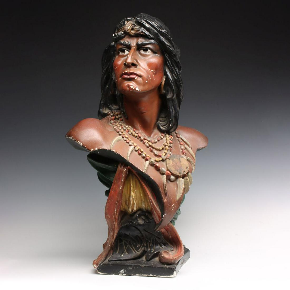 EARLY 20C. POLYCHROME PLASTER CIGAR STORE INDIAN BUST: The countertop figure of Hiawatha titled as such. Measures 28.5 x 18 inches. We happily provide seamless in-house packing and shipping services on nearly everything we sell, except international shipm