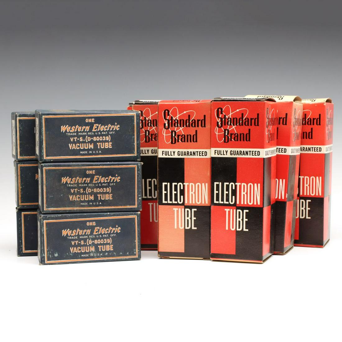 A COLLECTION OF BOXED VACUUM TUBES AND NIXIE TUBES: Six Western Electric vacuum tubes #VT-5 (D-80039) with original boxes. Plus five Standard Brand Nixie 'Electron Tubes' with original boxes, marked 'Used' with labels on the ends of the boxes. Boxes me