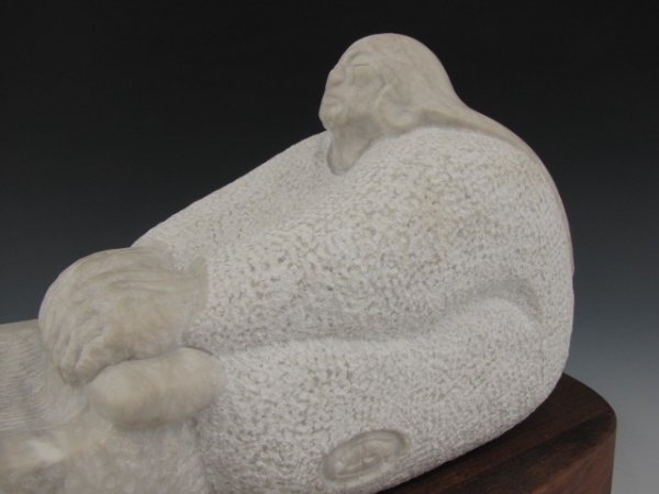 EARL EDER (1944-) CARVED NATIVE AMERICAN FIGURE: "Grinding Corn for the First Rain, 1980" , signed with monogram cut in the marble, additionally on the base, measures 8 x 13 x 6 inches, plus base. Eder is known for both sculpting and painting, and w
