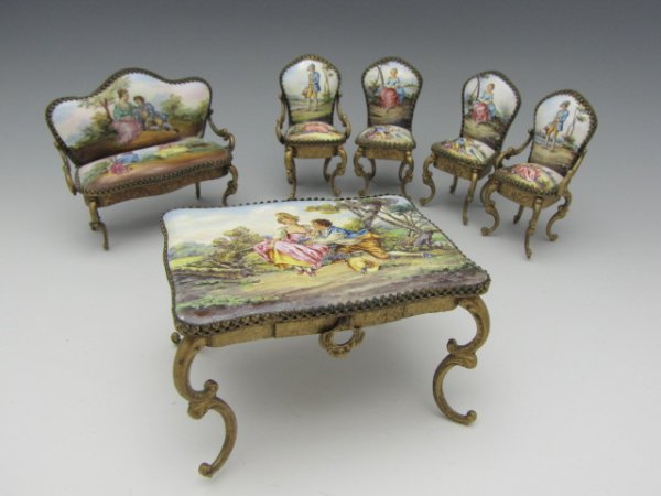 A SIX PIECE VIENNESE ENAMEL & GILT SALON SET: A beautifully enamel painted set with settee, bureau plat with functional drawer and pull, two arm chairs, two other highback chairs, all featuring classical 18th century courtship scenes. Settee meas