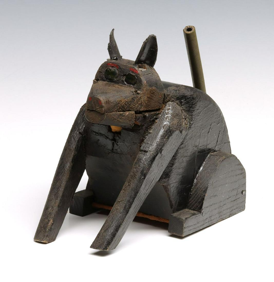 ANIMATED CARVING BY KANSAS OUTSIDER ARTIST ERNIE HANSEN: Ernie Hansen Recumbent Dog Mid to late 20th Century. About the artist, courtesy of AskArt.com, where Mr. Hansen is described as a Grassroots Artist: 'Lived near McClouth, Kansas working as a mechanic 