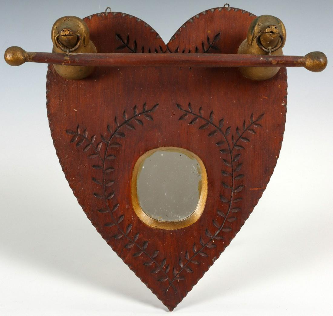 A HEART SHAPE FOLK ART MIRROR WITH FIGURAL DOG HEADS (1 of 10)