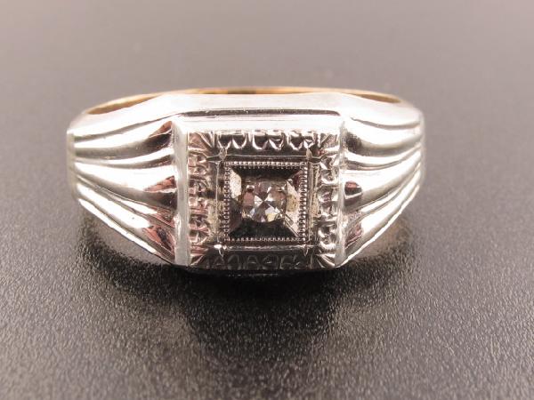 10K GOLD AND DIAMOND RING: 10K marked band, inset diamond, size 9-1/4, 3.9 grams.