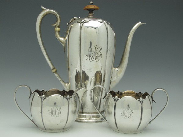 WATSON STERLING SILVER LOTUS COFFEE POT & CREAMER: Watson hallmarked 1-1/2 pint marked Lotus pot with brown finial, incised 'Lotus' pattern to bottom, 'B271/12', monogram to side, stands 8 inches. Also includes creamer and sugar, also numbered 271, bo
