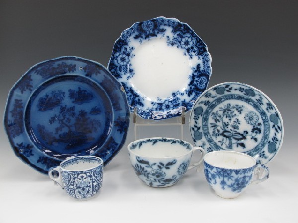 LOT OF SIX PIECES OF ANTIQUE FLOW BLUE CHINA: Includes a Wedgewood Ironstone 'Chapoo' pattern plate, 7.5 inches; a Johnson Bros 'Brooklyn' pattern 7 inch plate; a Staffordshire 'Onion' saucer, 5.75 inches; an unmarked 2.25 x 3.25 inch cup, plus t