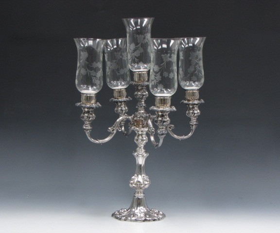 PAIR OF WALLACE SILVER PLATED FIVE-LIGHT CANDELABRAS: Pattern number 8318, three piece construction with Wallace marked bases, four branches plus center socket, five etched glass hurricanes.