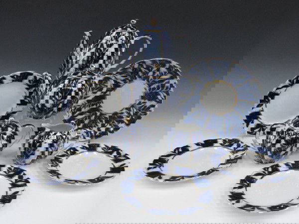 LOMONOSOV RUSSIAN PORCELAIN TEA SET: Includes an 8.5 inch underplate; coffee pot, 8 x 8 inches; teapot, 5.25 x 7.5 inches; creamer, 3.5 x 5 inches; sugar, 4.5 x 5.75 inches; and four 7 inch plates. Each with Lomonosov maker marks.