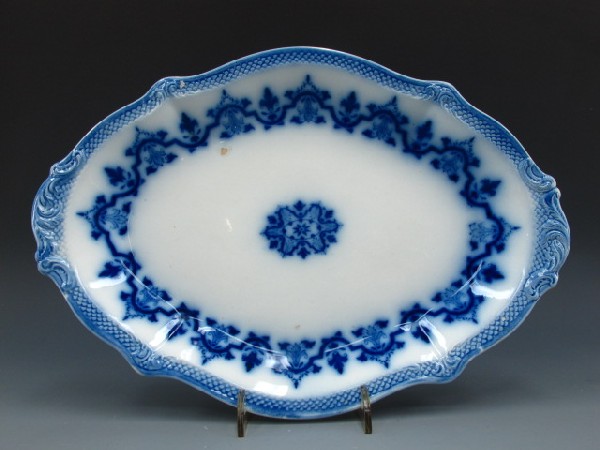 W.H. GRINDLEY FLOW BLUE CELTIC PLATTER 1897: Nice flow blue platter in Celtic pattern, W.H. Grindley marked reverse; measures 10.5 x 15.5 inches.
