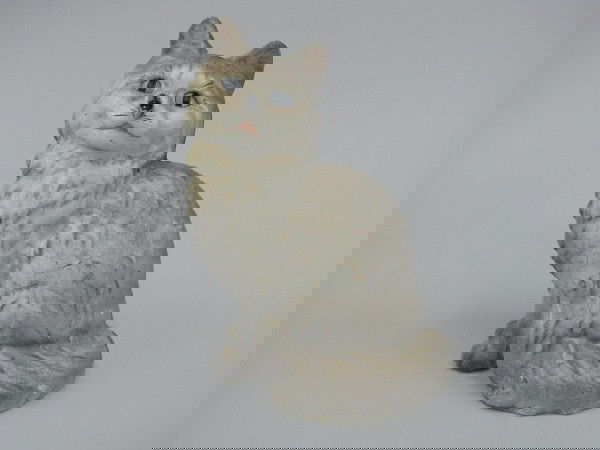 A HUBLEY PERSIAN CAT CAST IRON DOOR STOP: Repainted Persian Cat, no Hubley marks found, two-piece construction measures 8.75 x 6 inches.