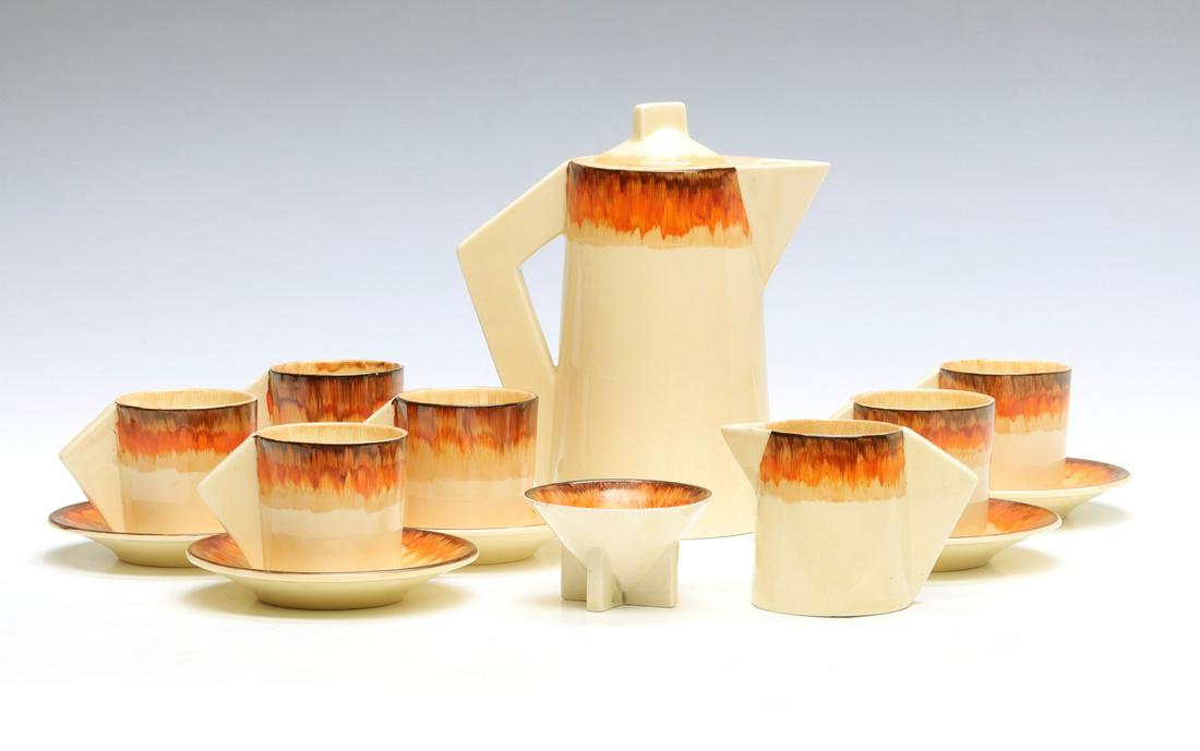 A CLARICE CLIFF 'AURA' PATTERN DEMITASSE SET (1 of 16)
