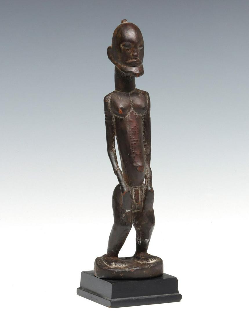 A DOGON STYLE CARVED WOOD FIGURE (1 of 15)