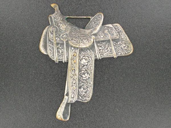 HEISER SADDLES, HAVANA CUBA ADVERTISING WATCH FOB: Die struck, double-sided, saddle-shaped fob with raised lettering on reverse, 'Lykes & Fernandez, Havana, Cuba, Agents for The Famous Heiser Saddles,' with Heiser Saddles logo, and Whitehead & Hoag ma