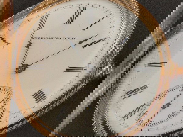 A BOXED WALTHAM WM ELLERY IN 14K HUNTING CASE: Weight of 59.7 grams. 14k solid gold hunting case marked A.W. Co, 14k, size 6, apparently 7J, #1014426, key wind, running condition unknown, lines in the dial at 5 and 8 positions. Displayed in an ant