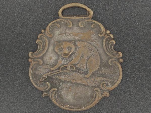 AN UNUSUAL WATCH FOB WITH BEAVER: Die struck bronze fob, single-sided with beaver, hand scratched 'John Money' on the reverse, measures 1.75 x 1.5 inches. Shows some wear and age, even toning.