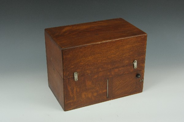 ANTIQUE MEDICAL ENGELMANN DRY CELL BATTERY: Includes instructions pasted to inside of lid. Wooden casing, appears to retain all dials, switches and posts. Measures 10 x 13 x 8 inches.