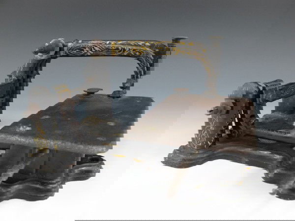 A WHEELER & WILSON SEWING MACHINE CIRCA 1853: Wheeler & Wilson plaque inset to base, unusual head, needle plate stamped with serial number 647570, 'The Wheeler & Wilson Mfg Co., Bridgeport, Conn.,' and patent dates, the last being Dec 19, 1853. M