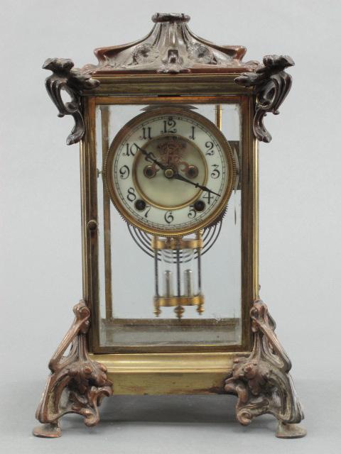 NEW HAVEN CRYSTAL REGULATOR WITH FAUX MERCURY PENDULUM: Four beveled glass panels, one with chipped corner, double sunk enamel dial with hairline, T/S, faux mercury pendulum. Measures 14 x 8 x 7.5 inches.