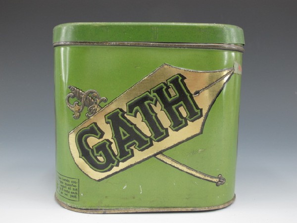 GATH CIGAR TIN, FACTORY #29 1ST DIST. OHIO: Green & gold, 5 1/2" tall 6" wide & 4" deep. There slogan, 'The Pin is mightier than the Sword" to one side.