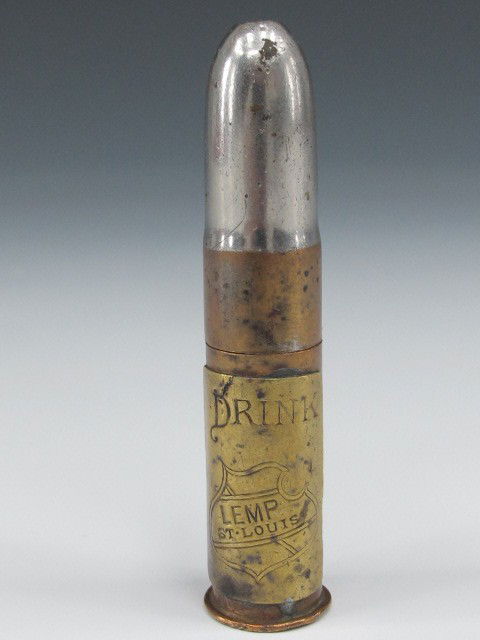 CORKSCREW BULLET, LEMP BEER, ST LOUIS: Measures 2 3/4", Williamson co. Newark N.J. made of Copper and nickel plated end with brass label, bullet comes apart and corkscrew comes out. Label on bottle reads Drink Lemp, St Louis, and with Lemp