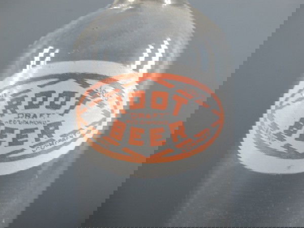 RED DIAMOND ROOT BEER BOTTLE: 12 1/2" x 3 1/4" has painted label that reads the liquid carbonic company, Root Beer draft red diamond, metal lid