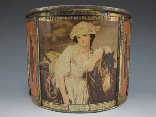 TIN TEA CADDY, CARR & CO. THE MILKMAID, 1936: half round tin container, girl with horse on front 6" x 7" x 3 1/2" hinged lid.