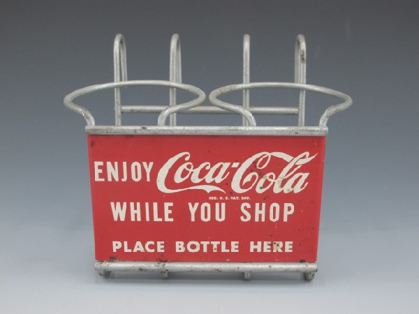 COCA-COLA BOTTLE HOLDER, SODA POP: 5" X 6" X 4", Wire frame tin litho coke sign, reads, enjoy Coca-cola while you shop, place bottle here.