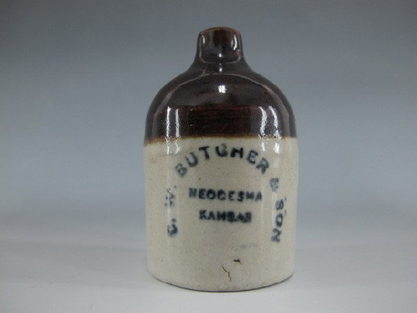 STONEWARE MINI JUG, BUTCHER NEODESHA KANSAS: 3" tall tan bottom brown top blue lettering, reads C.W. Butcher & son Neodesha Kansas.