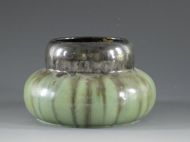 A FULPER ART POTTERY VASE: Two-color drip glaze, measures 4 x 6 inches, signed.