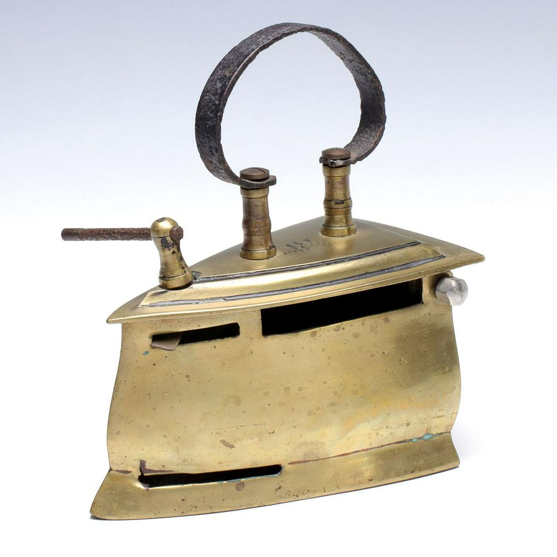 AN EARLY BRASS CHARCOAL PRESSING IRON STAMPED FAGLER (1 of 10)
