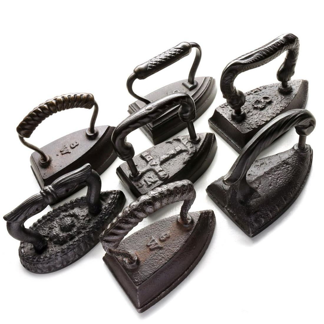 SEVEN ANTIQUE SAD IRONS WITH ORNATE HANDLES (1 of 13)