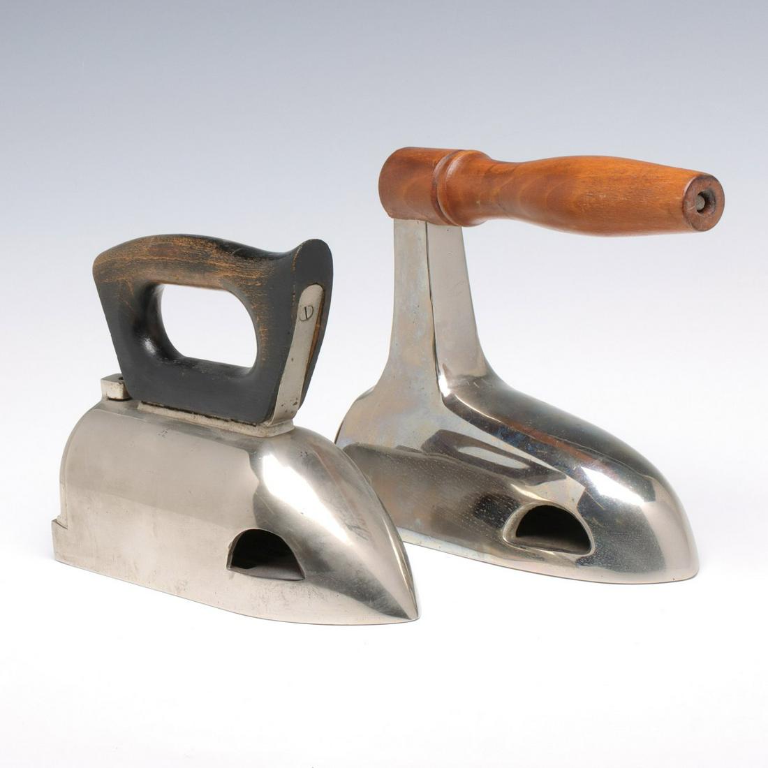 TWO OX TONGUE FORM BOX IRONS WITH NICKEL PLATING: The nickel plated irons with wooden handles. Measures 6.5 x 8 x 3.25 and 7.5 x 9 x 3.5 inches. We happily provide seamless in-house packing and shipping services on nearly everything we sell. Until fu