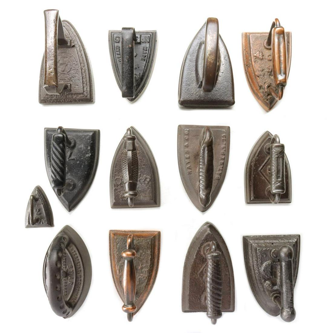 A COLLECTION OF ANTIQUE SAD IRONS (1 of 20)
