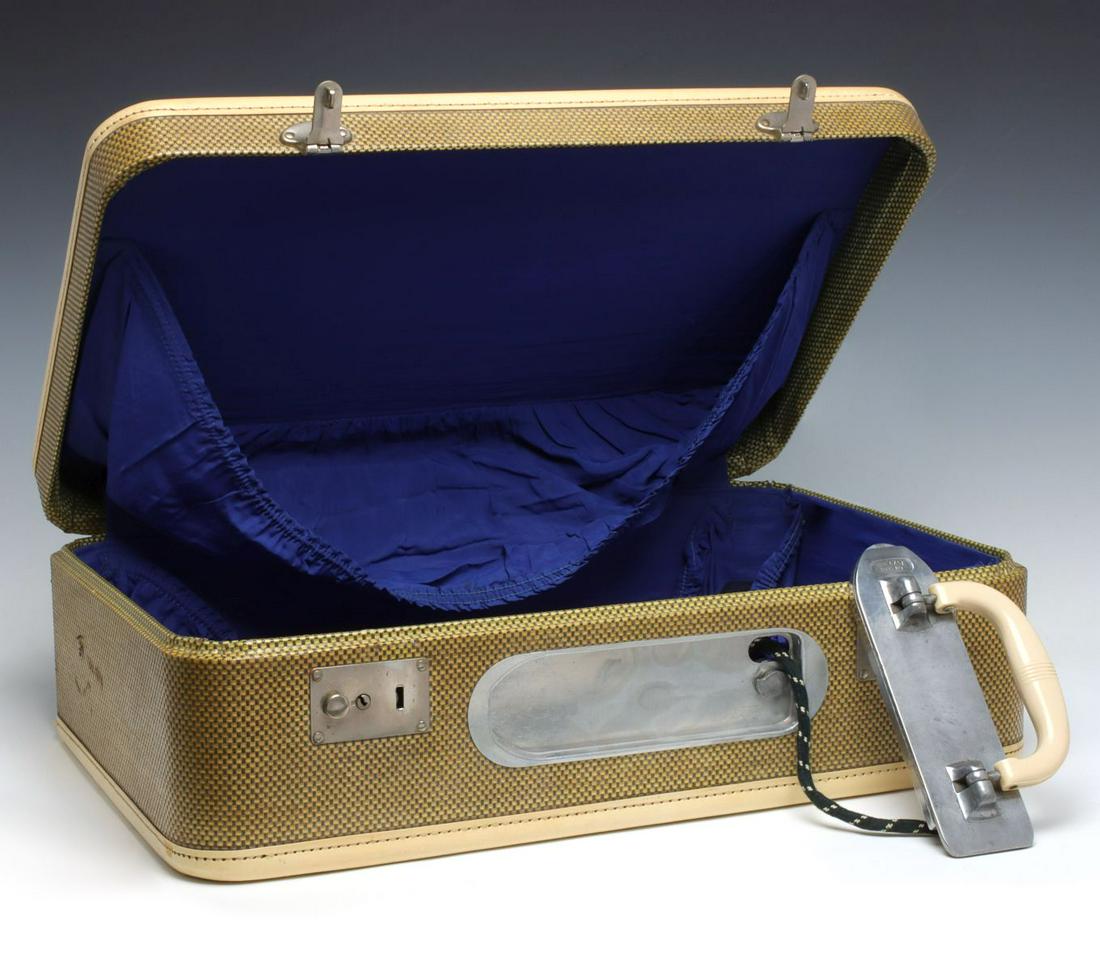 JANIS 'IRO-CASE' SUITCASE WITH TRAVEL IRON: The suitcase handle doubles as an electric travel iron, tweed suitcase with blue lining, signed on the handle/iron, patent dated 1947. Suitcase measures 7 x 21.25 x 13.75 and the iron measures 4 x 7.7