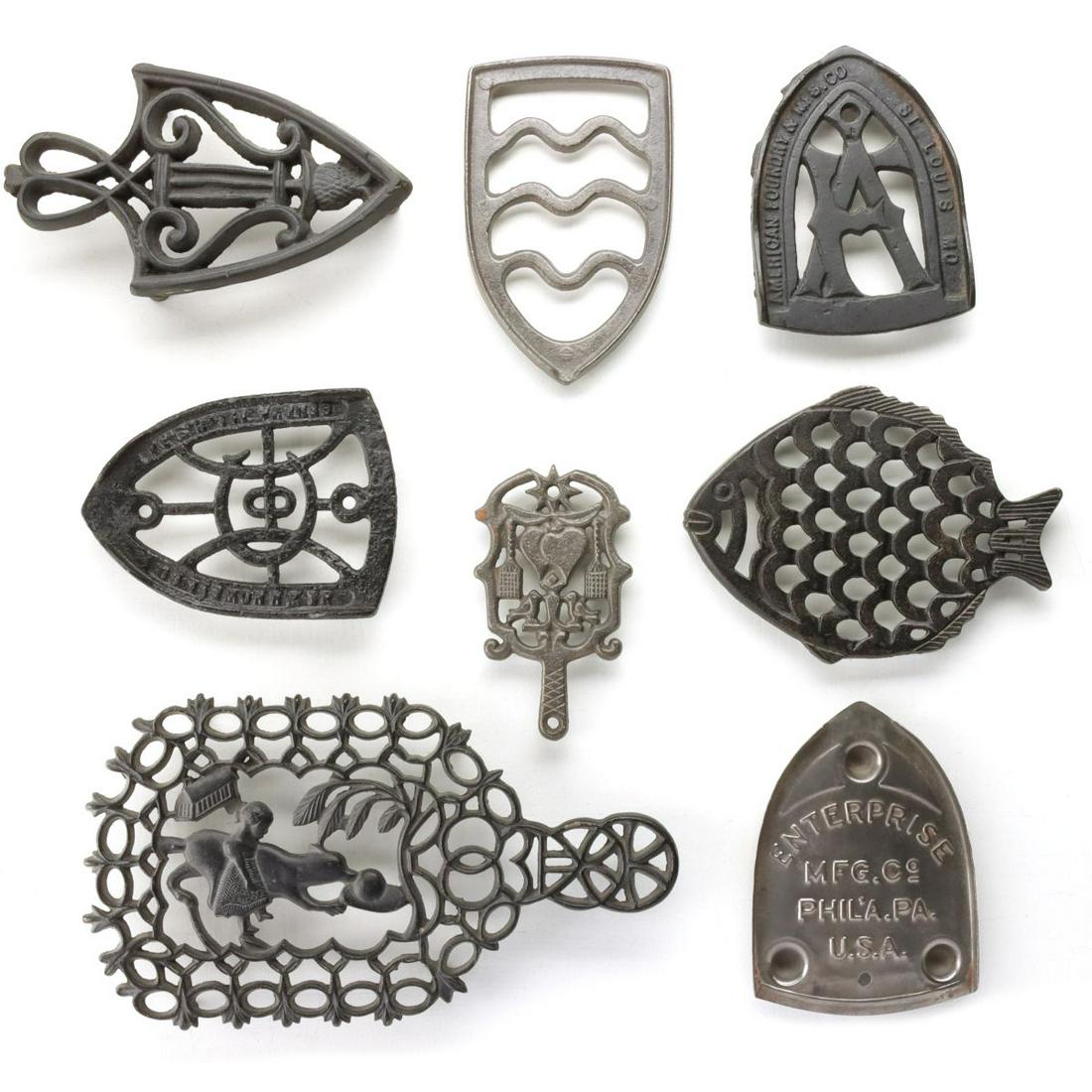 A COLLECTION OF FANCY PRESSING IRON TRIVETS (1 of 13)