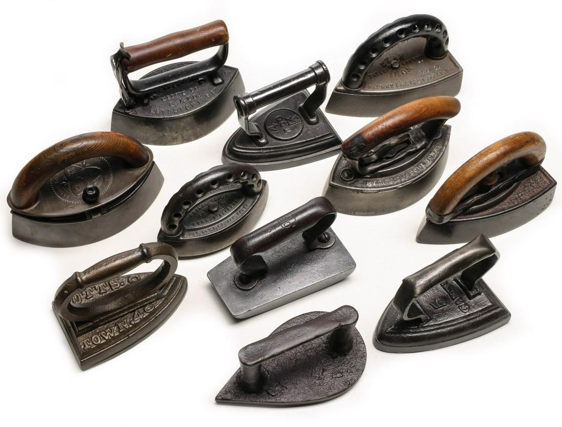A COLLECTION OF ANTIQUE SAD IRONS (1 of 9)