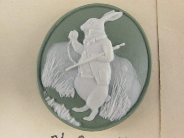 5 JASPERWARE BUTTONS AND 21 FIGURAL METAL BUTTONS: Five Wedgwood buttons including: a green oval Jasperware White Rabbit button, 2 inches; a blue round Jasperware swan, 1.25 inches; a blue grasshopper and the ant Jasperware button, 1 inch; and one eac