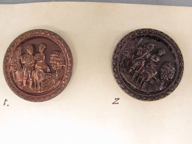 19 ANTIQUE VICTORIAN FIGURAL METAL BUTTONS: Nineteen figural metal buttons depicting Ralauf the Miller, St. George and the Dragon, King Arthur, five Bird on a Branch buttons, one French enameled button and more. Sizes from 2 to .75 inches.
